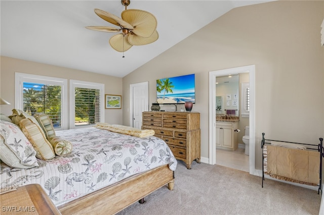 carpeted bedroom featuring ceiling fan, ensuite bath, and high vaulted ceiling