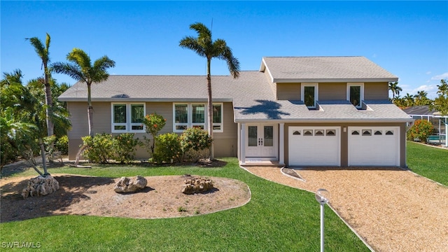 view of front facade featuring a garage and a front lawn