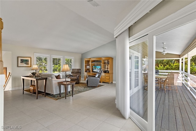 tiled living room with lofted ceiling