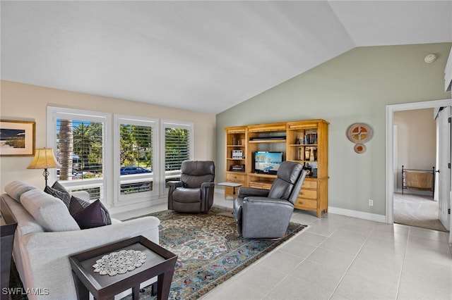 living room with lofted ceiling and light tile patterned flooring