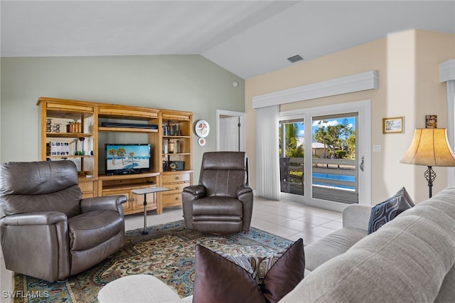 tiled living room featuring vaulted ceiling