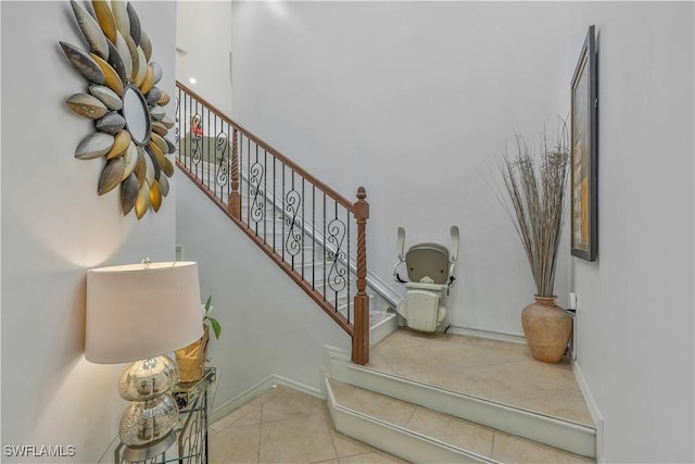 stairs featuring tile patterned flooring