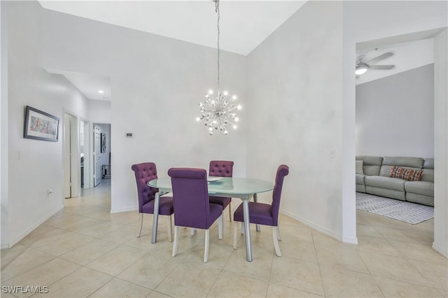 tiled dining space featuring ceiling fan with notable chandelier