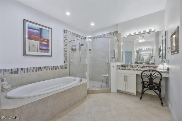 bathroom with shower with separate bathtub, tile patterned floors, and vanity