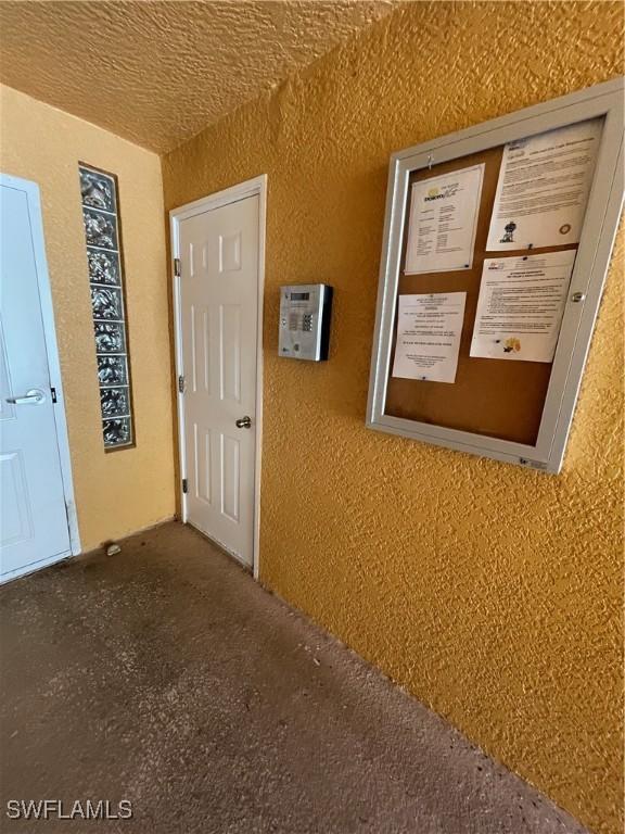 corridor with a textured wall