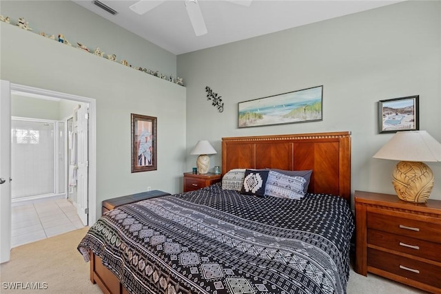 carpeted bedroom with ceiling fan and connected bathroom