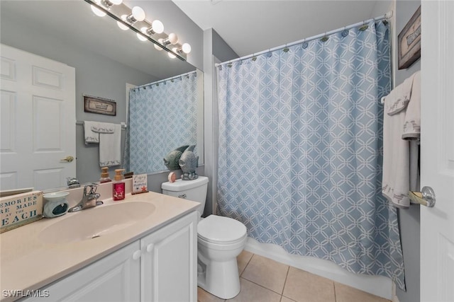 bathroom with a shower with curtain, tile patterned floors, toilet, and vanity