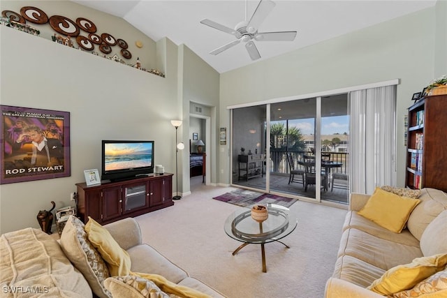 living room featuring light carpet, high vaulted ceiling, and ceiling fan