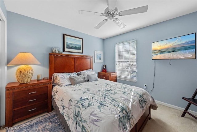 bedroom with ceiling fan and carpet