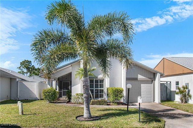 view of front facade with a garage and a front yard