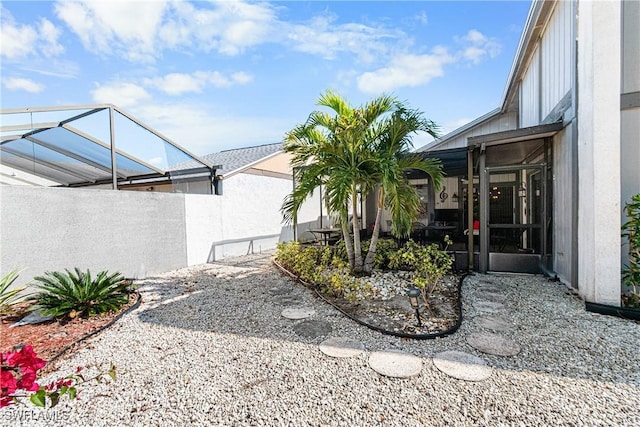 view of yard featuring a lanai