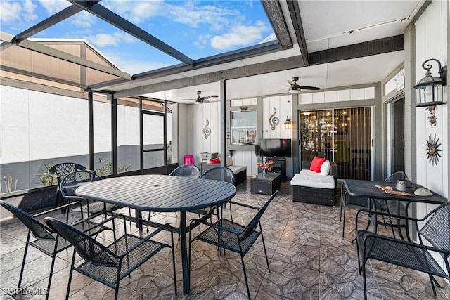 view of patio featuring an outdoor living space, a lanai, and ceiling fan