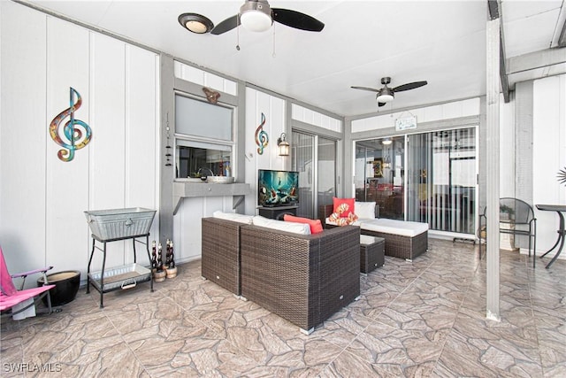 view of patio featuring ceiling fan and outdoor lounge area