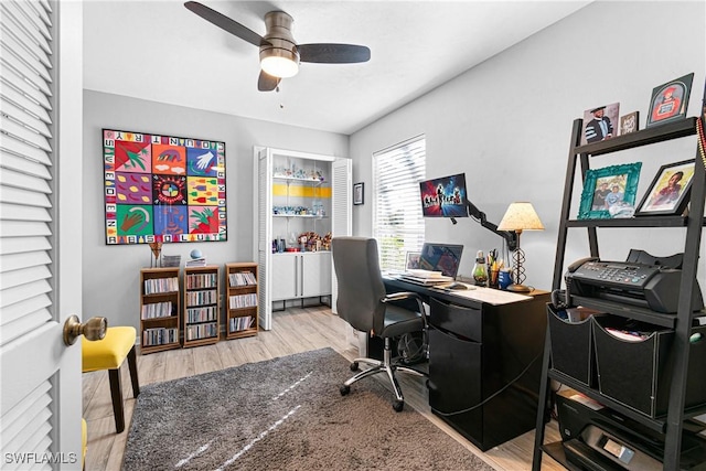 office featuring light hardwood / wood-style floors and ceiling fan