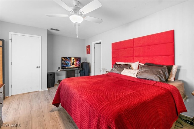 bedroom featuring ceiling fan and light hardwood / wood-style floors