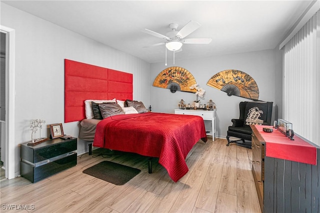 bedroom featuring ceiling fan and light hardwood / wood-style flooring