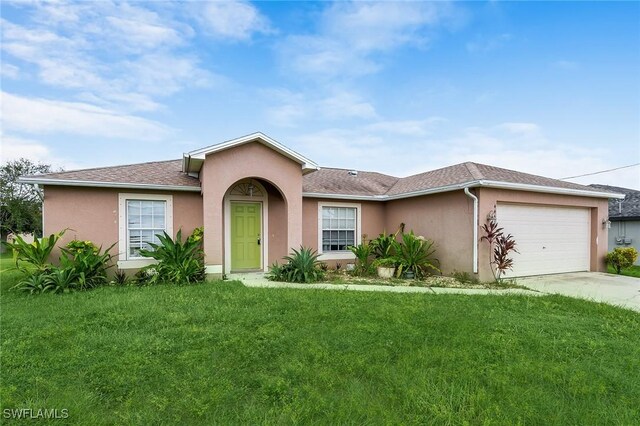 ranch-style home featuring a garage and a front lawn