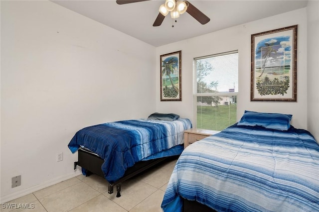 bedroom featuring light tile patterned floors and ceiling fan