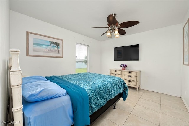 bedroom featuring light tile patterned floors and ceiling fan