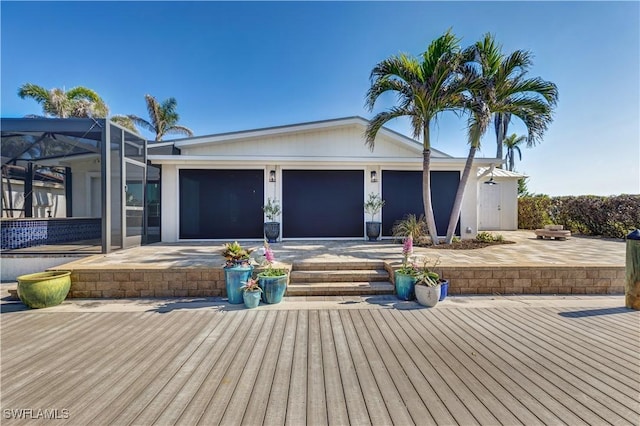 exterior space featuring a patio and glass enclosure