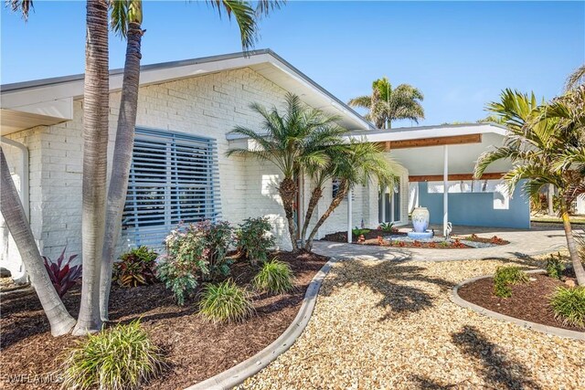 view of front of house with a carport