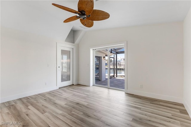 unfurnished room featuring lofted ceiling, ceiling fan, and light hardwood / wood-style flooring