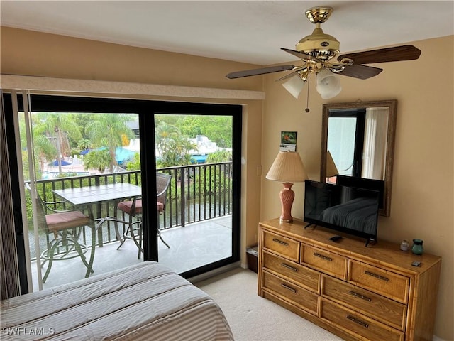 bedroom featuring light carpet, access to exterior, ceiling fan, and multiple windows