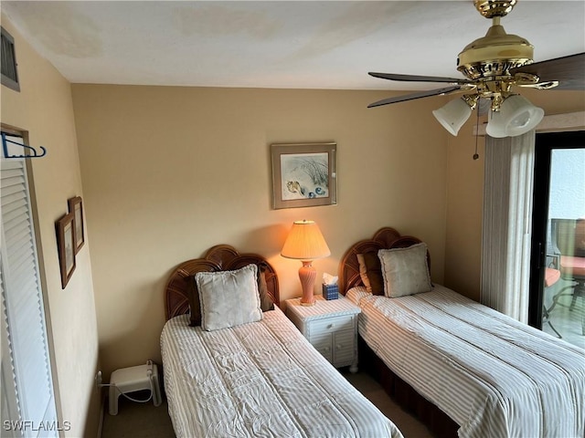 bedroom featuring access to outside, carpet flooring, and ceiling fan