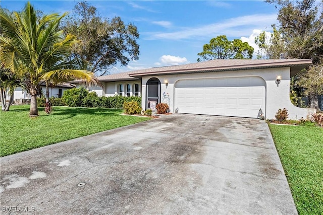 ranch-style house with a garage and a front lawn