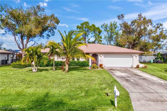 ranch-style house featuring a garage, central AC, and a front yard