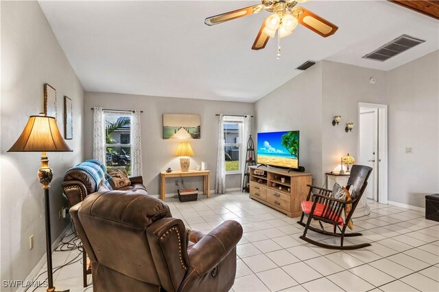 living room featuring light tile patterned flooring, ceiling fan, and lofted ceiling