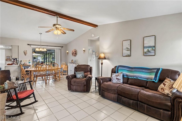 living area with lofted ceiling with beams, ceiling fan with notable chandelier, and light tile patterned flooring