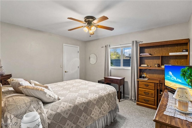 bedroom featuring light colored carpet and ceiling fan