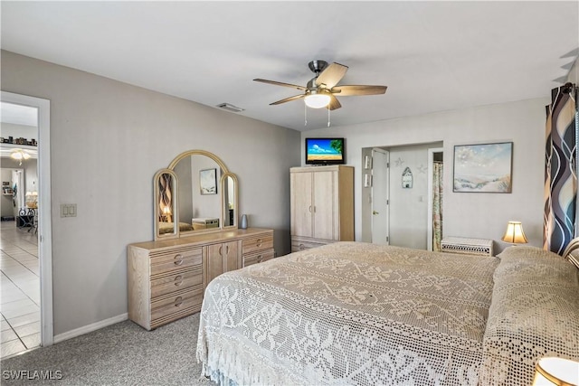 bedroom featuring ceiling fan and light colored carpet