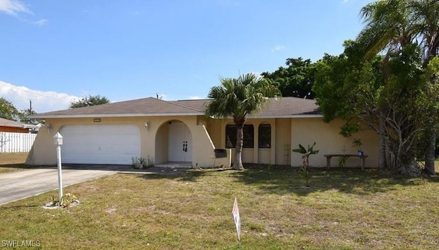 single story home featuring an attached garage, fence, concrete driveway, stucco siding, and a front lawn