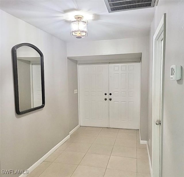 entrance foyer with visible vents, baseboards, and light tile patterned floors