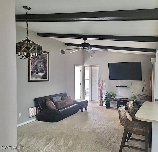 carpeted living room featuring visible vents, lofted ceiling with beams, baseboards, and ceiling fan with notable chandelier