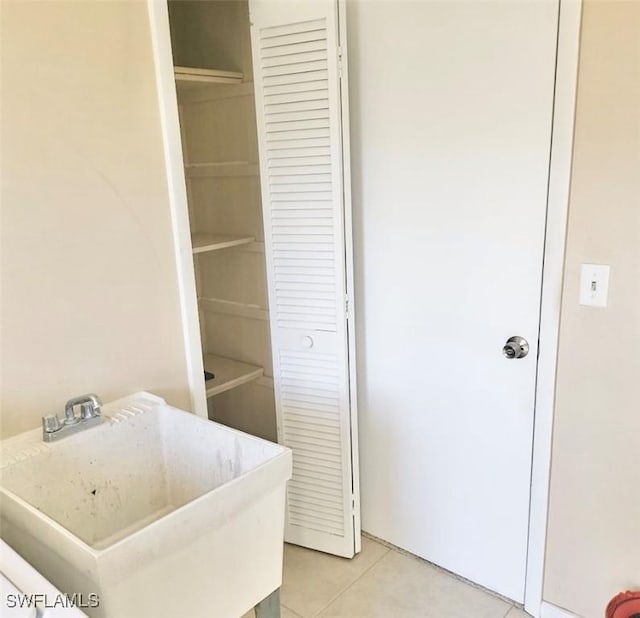 bathroom with a sink and tile patterned floors