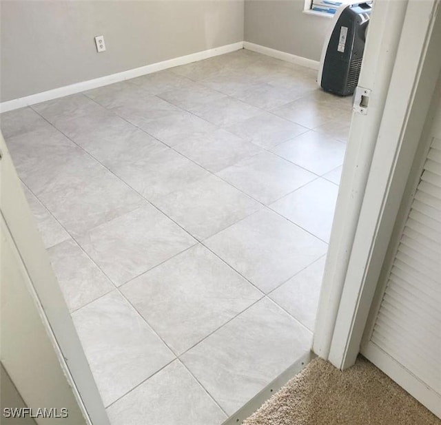 spare room featuring baseboards