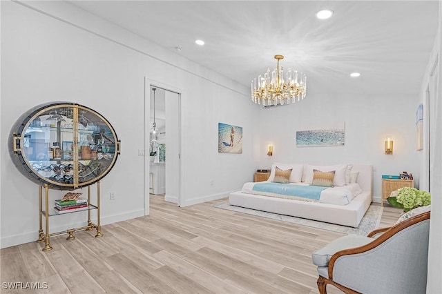 interior space with a notable chandelier and light wood-type flooring