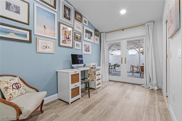 office space featuring french doors and light wood-type flooring