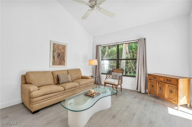 living room featuring ceiling fan, high vaulted ceiling, and light wood-type flooring