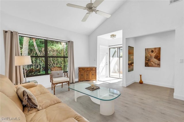 living room with high vaulted ceiling, light hardwood / wood-style floors, and ceiling fan