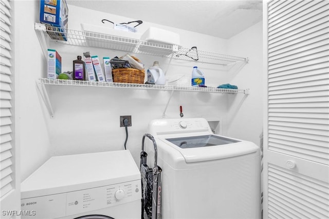 laundry room with separate washer and dryer