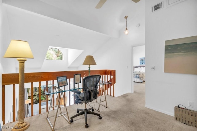 carpeted home office with high vaulted ceiling and ceiling fan