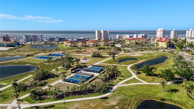 drone / aerial view featuring a water view and a city view