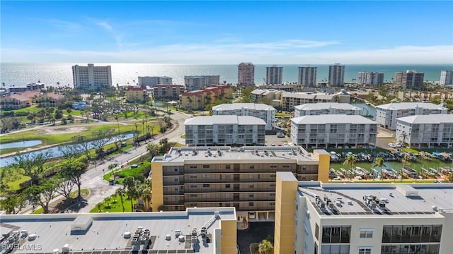 drone / aerial view featuring a water view and a city view