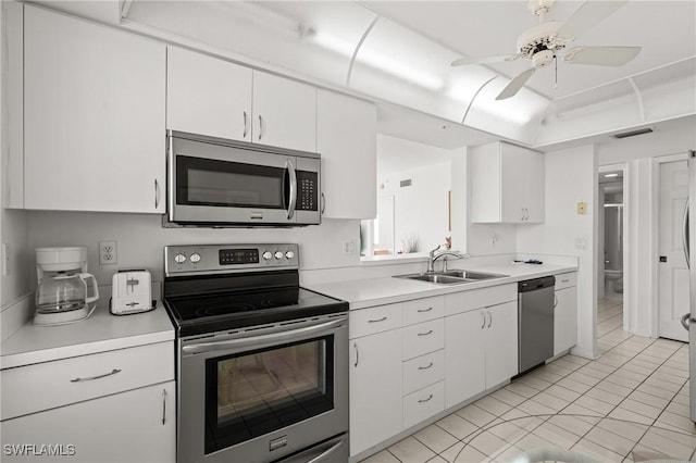 kitchen featuring a sink, visible vents, white cabinets, light countertops, and appliances with stainless steel finishes