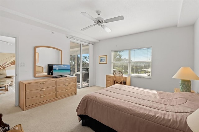 bedroom with access to exterior, multiple windows, a ceiling fan, and light colored carpet