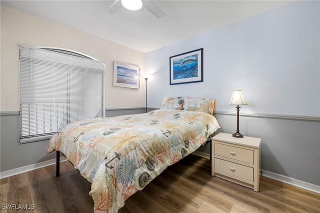 bedroom with wood-type flooring and ceiling fan